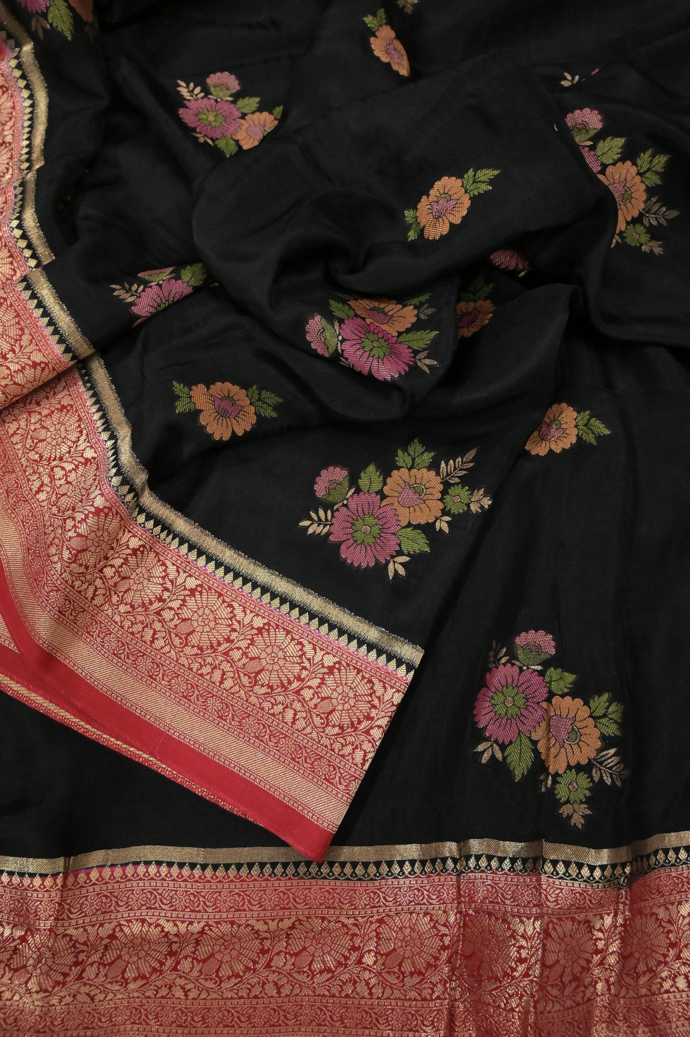 Black and Red Color Muga Banarasi with Allover Meenakari Buta and Golden Zari Border